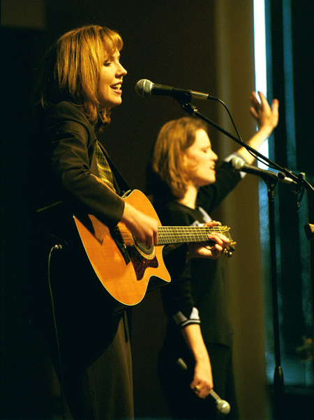 Dayna Curry and Heather Mercer lead in a time of praise and worship during the chapel service. - Photo by Jim Veneman