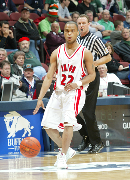 Rod Ross handles the ball in the first round of the NAIA National Tournament. - Photo by Uncredited