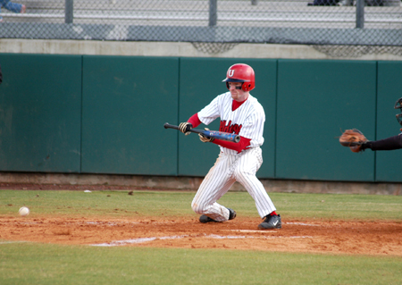Union's lead-off hitter Kyle Yates lays down a bunt. - Photo by Steven Aldridge