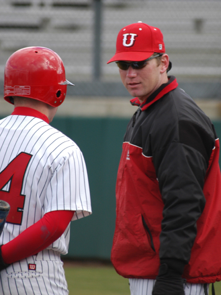 First year assistant Brian Pepper shares hitting instructions with Zach Lowery. - Photo by Steven Aldridge