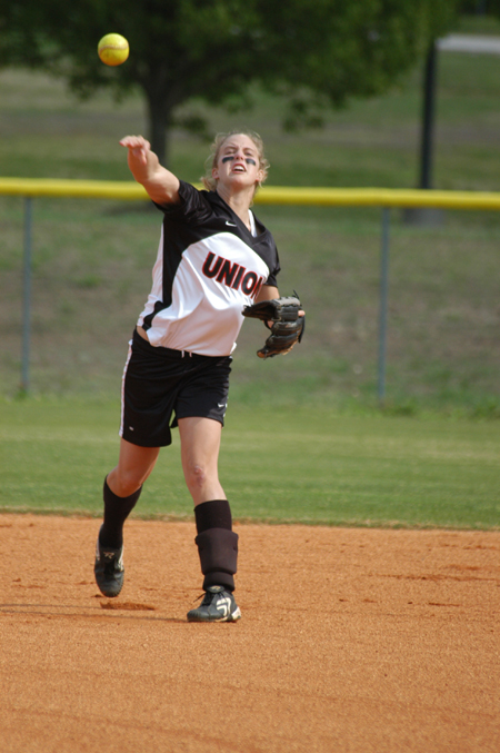Sophomore shortstop Amy Chatham makes a throw across the diamond to putout a runner at first. - Photo by Steven Aldridge
