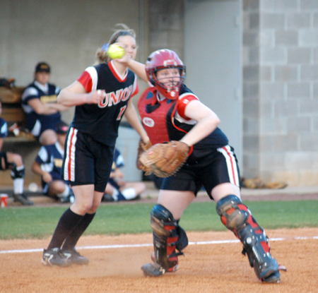 Union catcher Kylie Sullivan fields a bunt and prepars to throw down to first base.  Jackie Cliff (12) looks on from behind the play. - Photo by Steven Aldridge