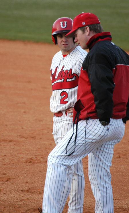 Senior outfielder Jeffrey Jackson talks with Union assistant coach Brian Pepper at first base. - Photo by Steven Aldridge