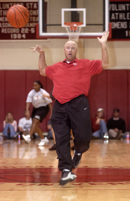 Head Coach for the men's basketball team, Ralph Turner, is having a ball at Midnight Madness. - Photo by Jim Veneman