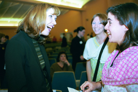 Dayna Curry takes time to speak with students after her chapel presentation. - Photo by Jim Veneman