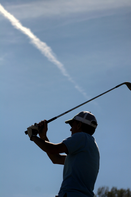 Mickey Armstrong watches his drive during a Union golf practice. - Photo by Kyle Kurlick