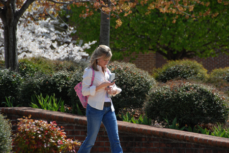 Anna Snyder checks her messages on a beautiful spring day on Union's campus. - Photo by Morris Abernathy