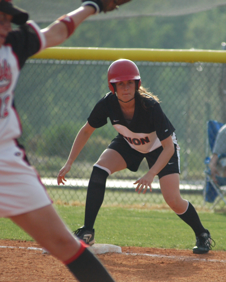 Freshman outfielder Michelle Alboneti eyes the pitcher's delivery prior to taking her lead at first base. - Photo by Steven Aldridge