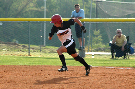 Senior Holly Haycraft takes off from first for her record setting 170 career stolen base a game one win over Martin Methodist.  This stolen base put Haycraft as the NAIA's all-time career stolen base leader. - Photo by Steven Aldridge