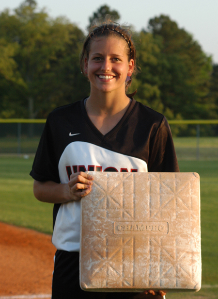 Senior Holly Haycraft poses with the base that made her the NAIA's all-time career stolen base leader when she stole career base number 170 in a game one win over Martin Methodist. - Photo by Steven Aldridge