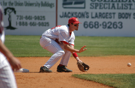 Junior second baseman Jason Cooper awaits a throw from the catcher as an opposing player (not pictured) attempts to steal the base. - Photo by Steven Aldridge