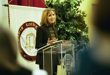 Dayna Curry speaks about her Taliban imprisonment at a banquet following the chapel service. - Photo by Jim Veneman