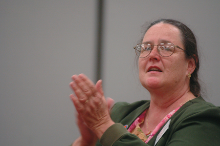 Dr. Marlyn Newhouse, director of the West Tennessee Regional Science Fair, cheers for the
students who participated. - Photo by Kristen Nicole Sayres
