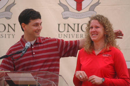 Union head coach Mark Campbell (left) recognizes his assistant coach for five seasons Katie Woodruff at the celebration honoring Union's 2006 NAIA National Championship.  Woodruff announced her resignation for a program director position at WinShape Camp for Girls in Rome, Georgia. - Photo by Kristen Nicole Sayres
