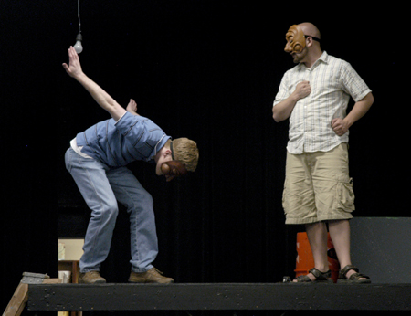 Mr. Nickels as Satan, portrayed by Andy Morris, bows in deference to Mr. Zuss as God, portrayed by Ben Lancaster during practice of the theatre's production of <em>J.B.</em>. - Photo by Stephanny Rodriguez