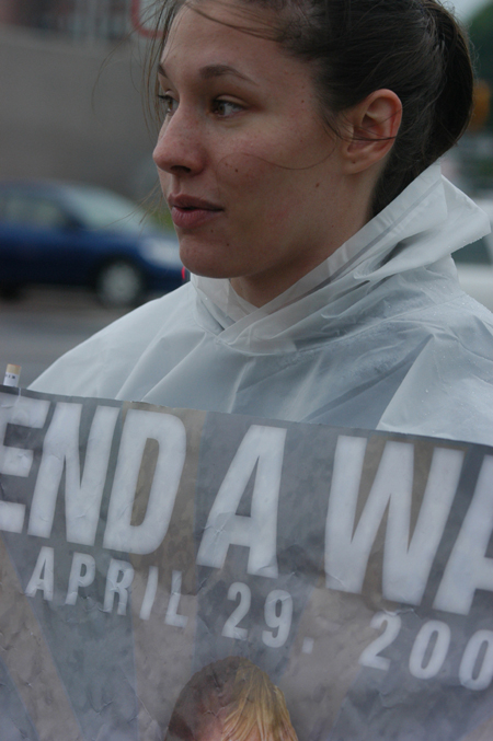 Senior Danielle Spaulding, psychology major, volunteered at the Global Night Commute by holding a sign to direct cars into the correct parking area. - Photo by Heather Phillips