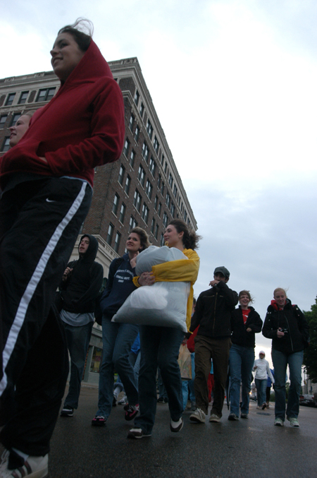 Union students walk through downtown Jackson during the Invisible Children Global Night Commute to raise awareness of the genocide occurring in Sudan and Uganda. - Photo by Heather Phillips