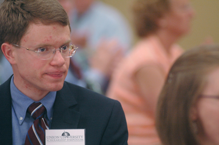 Kenneth Lewoczko, one of the student presenters, enjoys the banquet following the Scholarship Symposium. - Photo by Kyle Kurlick