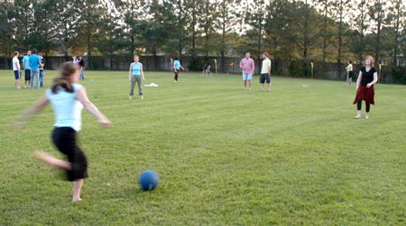 Graduating seniors play a game of kickball at President Dockery's house during Happy Trails, a farewell event sponsored by Young Alums. - Photo by Brad Moore