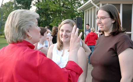 Kristin Veach (middle) and Catherine Vinson (right) fellowship with First Lady Lanese Dockery during Happy Trails, a farewell event for graduating seniors sponsored by Young Alums. - Photo by Brad Moore