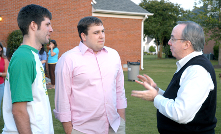 President Dockery shares some words of wisdom with Stephen Foshee (middle) and Jason Nolen (left) during Happy Trails, a farewell event for graduating seniors sponsored by Young Alums. - Photo by Brad Moore
