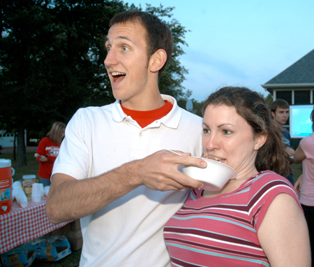 Tony Winkler and Denise Baughman, mathematics and computer science majors, goof off while having a picture taken during Happy Trials, a farewell event for graduating seniors sponsored by Young Alums. - Photo by Brad Moore