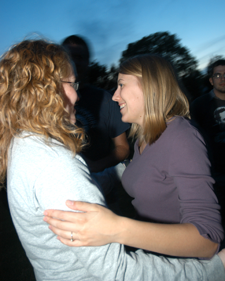 Amber Huffman (right) and Rachel Melton (left) celebrate their graduation during Happy Trails, a farewell event for graduating seniors sponsored by Young Alums at President Dockery's house. - Photo by Brad Moore