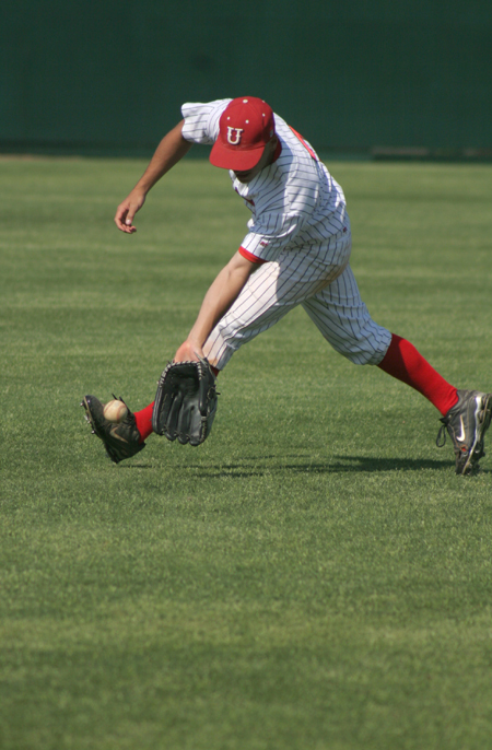 Freshman outfielder Jacob Martinez fields a grounder during the Bulldog's pre-game warmup. - Photo by Kyle Kurlick