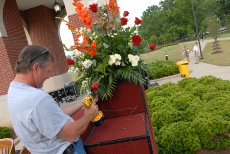 Members of the facilities management team spent many hours preparing the Great Lawn for the spring graduation ceremony. - Photo by Morris Abernathy