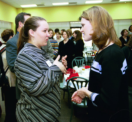 Heather Mercer spends some time with Theatre major Lindsey Garner after a luncheon. - Photo by Jim Veneman