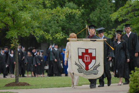 Senior Class President Luke Pruett led the graduates' processional to the Great Lawn for the spring graduation ceremony. - Photo by Kathleen Murray