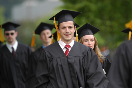 Marko Pavlovic and Michelle Pierce make their way to the Great Lawn for the spring graduation ceremony. - Photo by Morris Abernathy