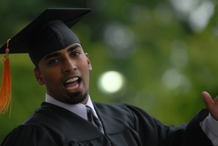 Nursing graduate Obed Thomas of Mesquite, Tx. makes his way to the Great Lawn for spring graduation. - Photo by Kathleen Murray