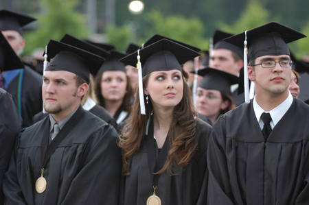 Josh Brubaker, Jenny Buffington and Sam Bullington wait for the rest of the class of 2006 during the spring graduation processional. - Photo by Morris Abernathy