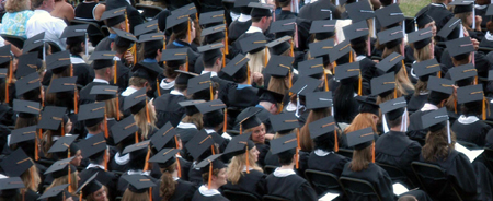 Graduates prepared to receive their diplomas on the Great Lawn during the spring graduation ceremony. - Photo by Morris Abernathy