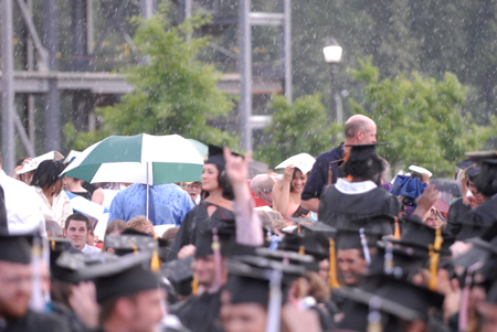About halfway through the reading of the graduates' names the rains began to fall. - Photo by Kathleen Murray