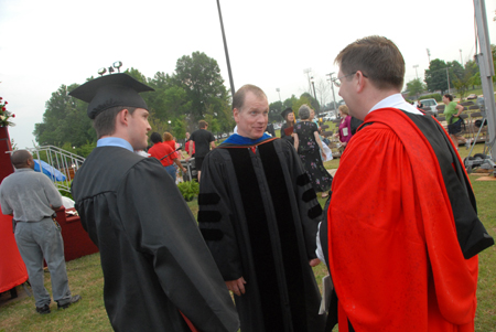 Southeastern Baptist Theological Seminary President Danny Akin (center) speaks with Ray Van Neste, assistant professor of Christian studies at Union. Akin's son Paul (left) received a bachelor of arts in biblical studies. - Photo by Morris Abernathy