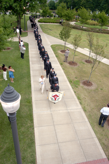 Senior Class President Luke Pruett led the graduates' processional to the Great Lawn for the spring graduation ceremony. - Photo by Heather Phillips
