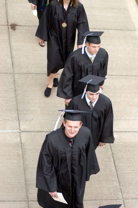 Matt Trammell, Matt Turner and Brandt Waggoner file to the Great Lawn for the spring gradation ceremony. - Photo by Heather Phillips