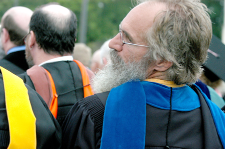 J. Daryl Charles, associate professor of Christian studies, watched as some of his students received degrees during the ceremony on the Great Lawn.  - Photo by Heather Phillips