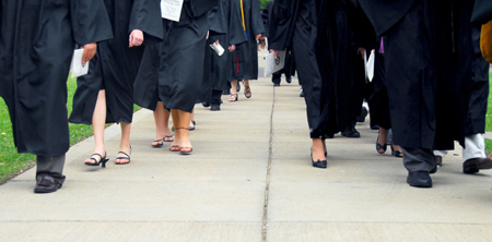 Graduates and faculty members made their way from the Penick Academic Complex to the Great Lawn for the spring graduation ceremony. - Photo by Kyle Kurlick