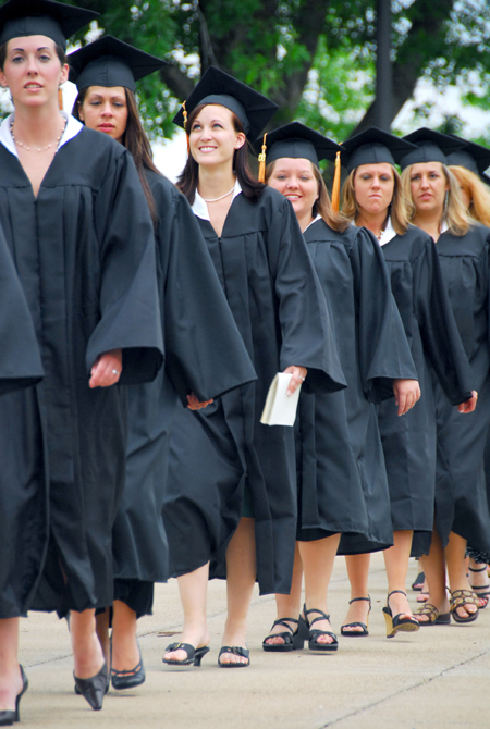 Shana Willows (center), nursing graduate, turns her eyes skyward as she reflects on her time at Union and her future during the spring graduation processional. - Photo by Kyle Kurlick