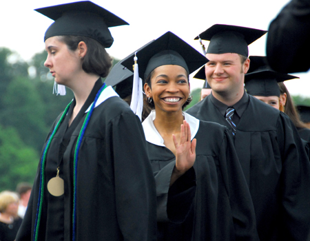 Heather Castleberry, Vicky Graves and Brad Moore make their way to their seats on the Great Lawn for the spring graduation ceremony. - Photo by Kyle Kurlick