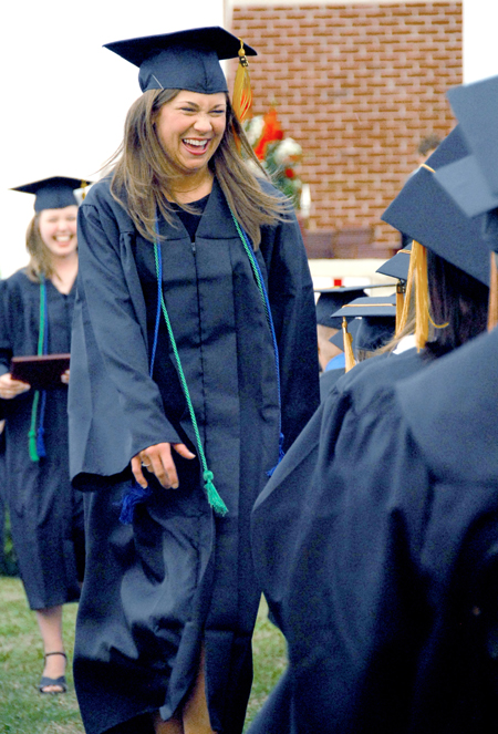 Jessica Rae Cherry of Germantown, Tenn. rejoices after receiving a bachelor of science degree in learning foundations. - Photo by Kyle Kurlick