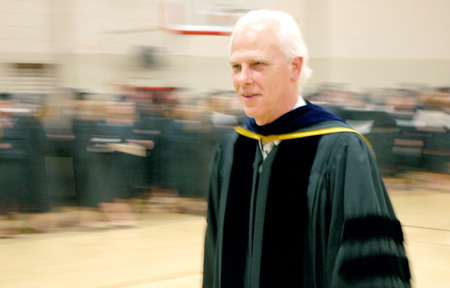 Professor of History Stephen Carls watches in the small gym as the Class of 2006 prepares for graduation ceremonies. - Photo by Matthew Diggs