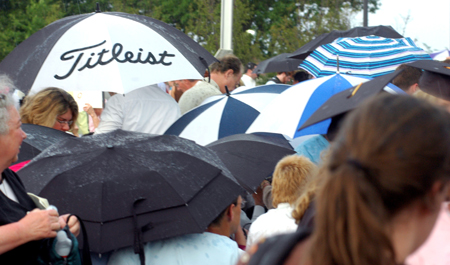 Heavy rain fell near the close of graduation ceremonies on the Great Lawn. Despite the bad weather, the line of students receiving degrees continued to completion. - Photo by Matthew Diggs