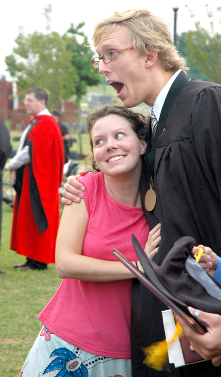 Nathan Earl Michael celebrates graduation on the Great Lawn. Michael earned a bachelor of arts degree in Spanish. - Photo by Matthew Diggs