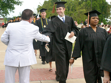 Associate Vice President for University Relations and Alumni Services Gary Williams greets the newest Union graduates of May 2006. - Photo by Stephanie Schroeder