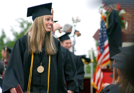 Amber Lutz of Charleston, Ill. smiles after receiving a bachelor of science degree in business administration. Lutz studied marketing and psychology. - Photo by Stephanie Schroeder