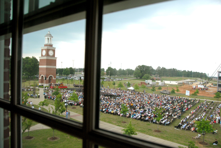 A view of graduation ceremonies on the Great Lawn from inside Jennings Hall. - Photo by Tim Weisemann